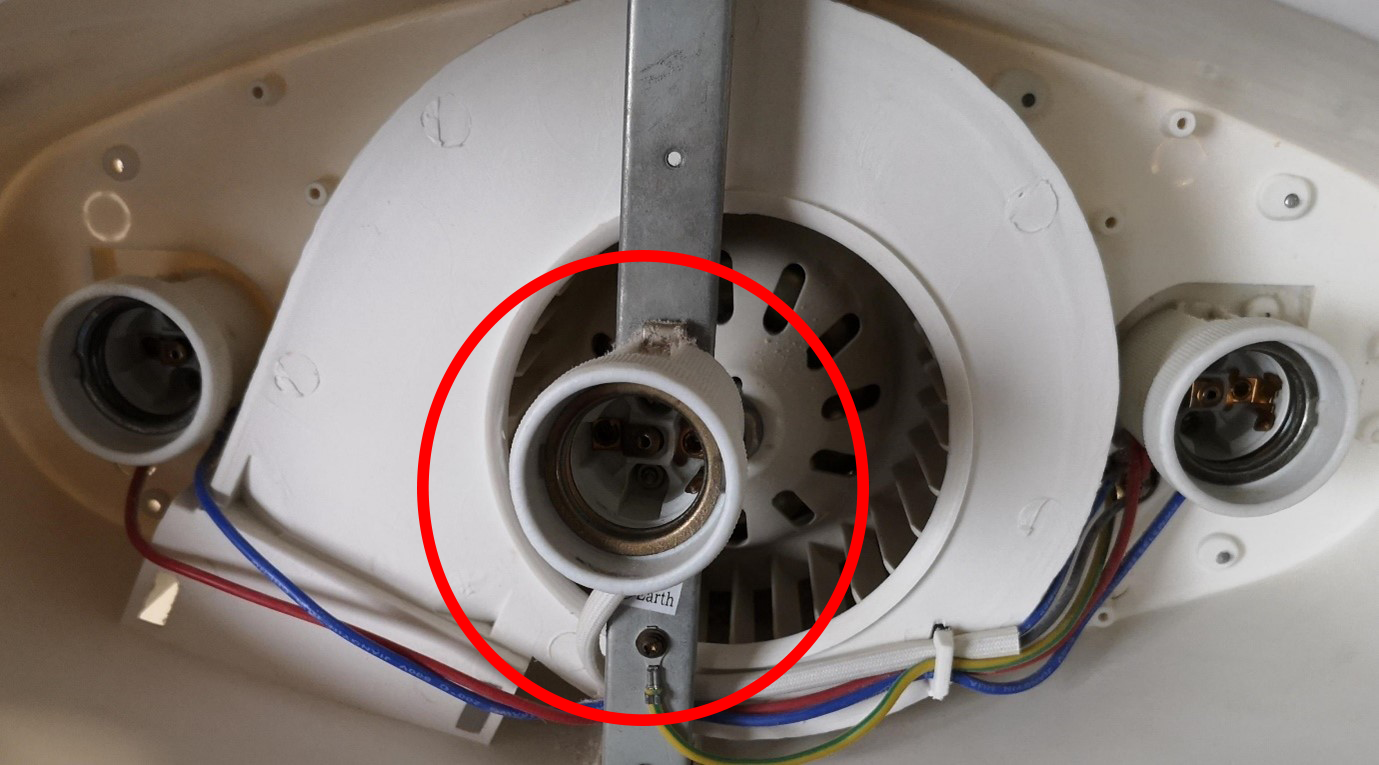 [image] Example of a newer model with correct porcelain lamp holders circled in red.