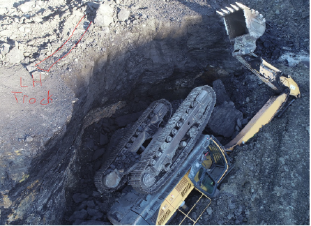 [Image] Excavator fallen into hole. 