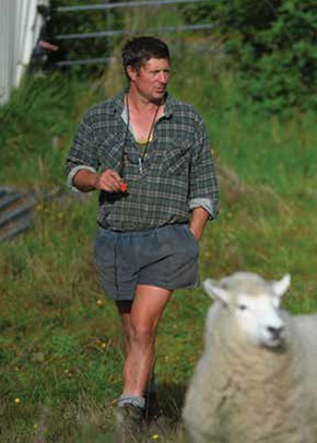 [image] A farmer and a sheep 