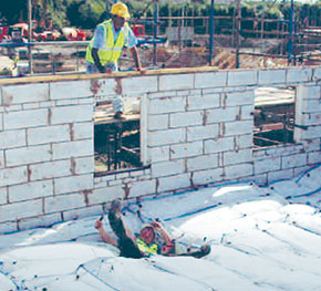 [image] A worker falls into a soft landing system on a construction site