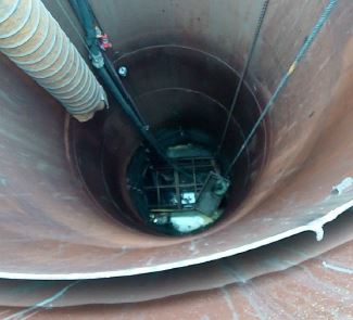 [image] View of man cage looking down shaft.