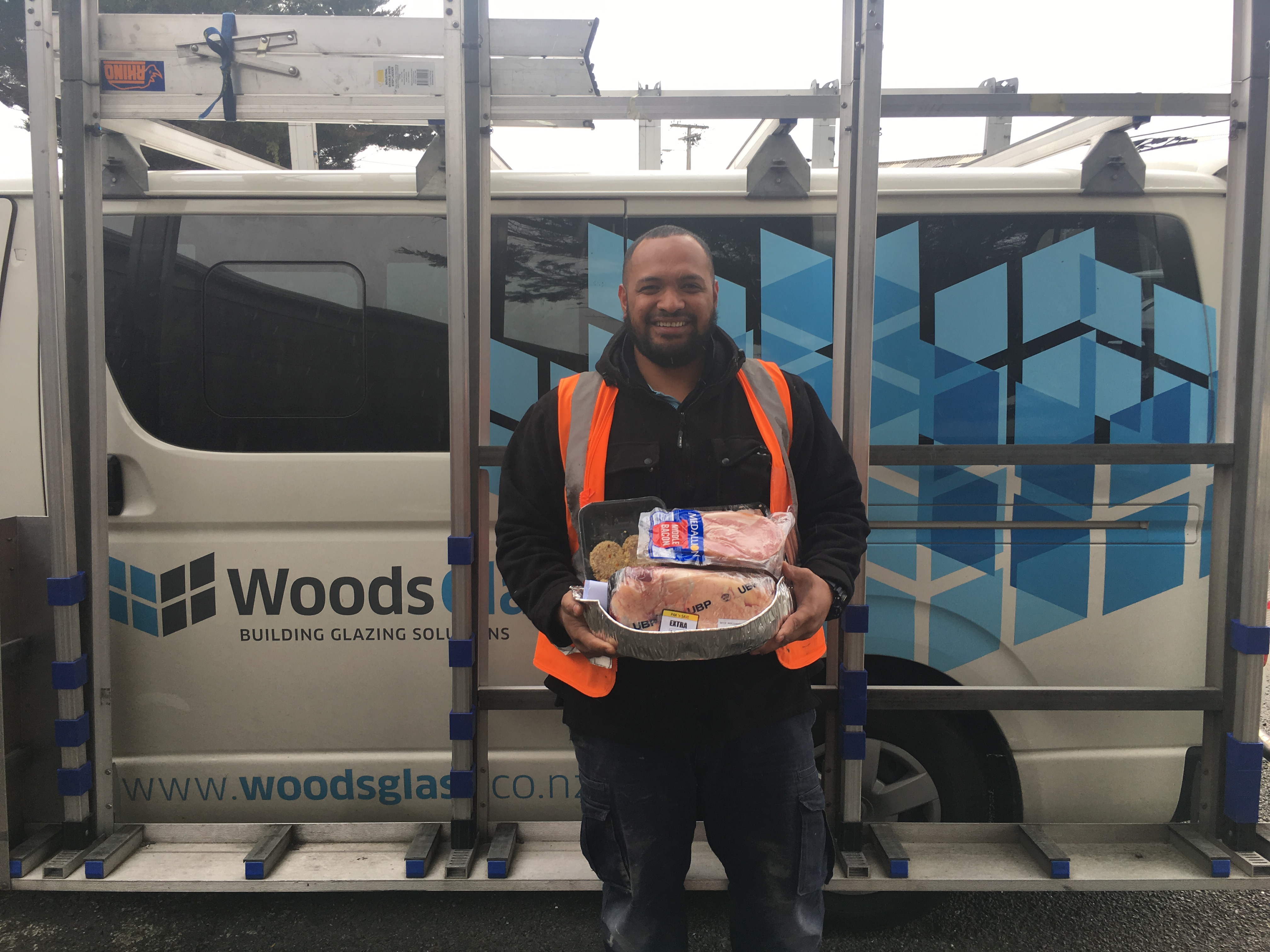 Woods Glass worker holding meat pack