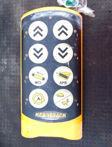 [image] An old, worn-out yellow and black remote control device with icons on the buttons