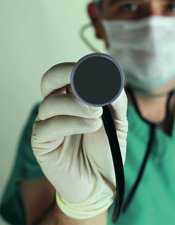 [image] close up of a doctor holding a stethoscope